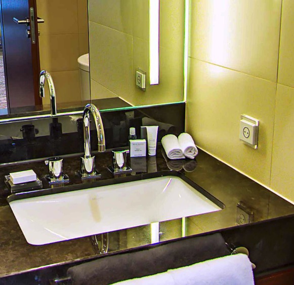 Vanity with toiletries and towels