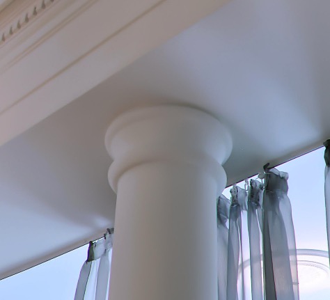 Classical column detail beneath the crown molding